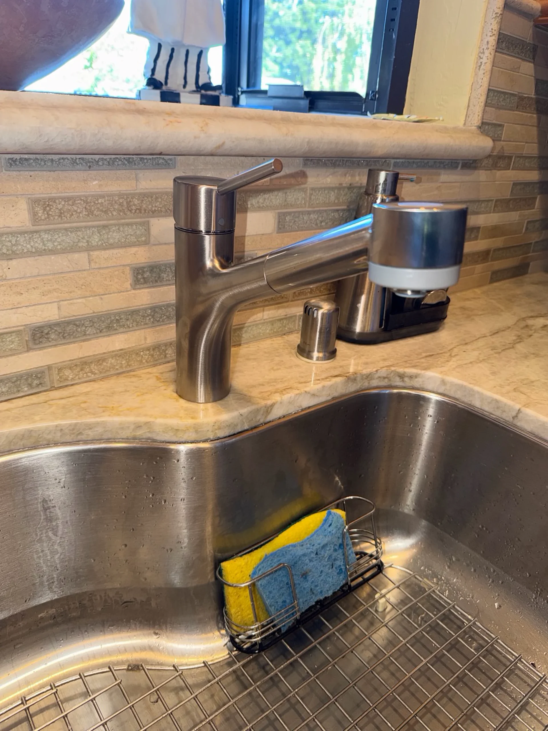 Clean faucet and fixture work in a Campbell kitchen.