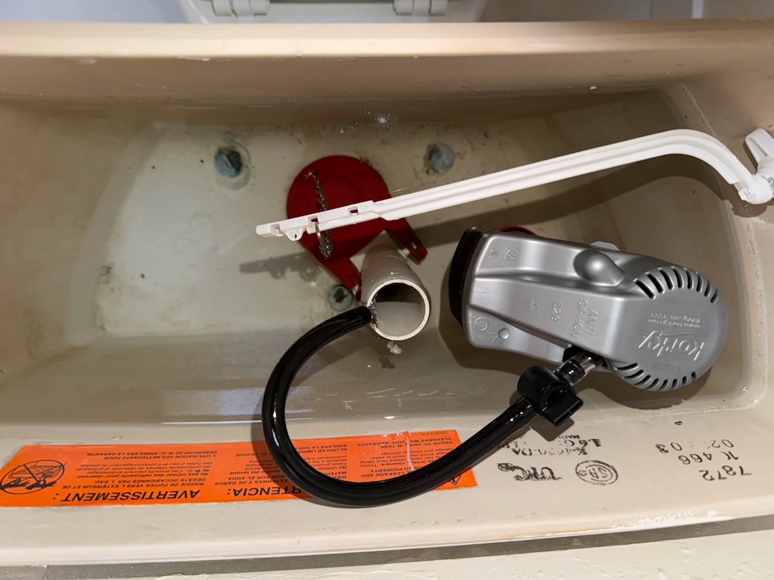 A new garbage disposal installed under a Los Gatos kitchen sink.