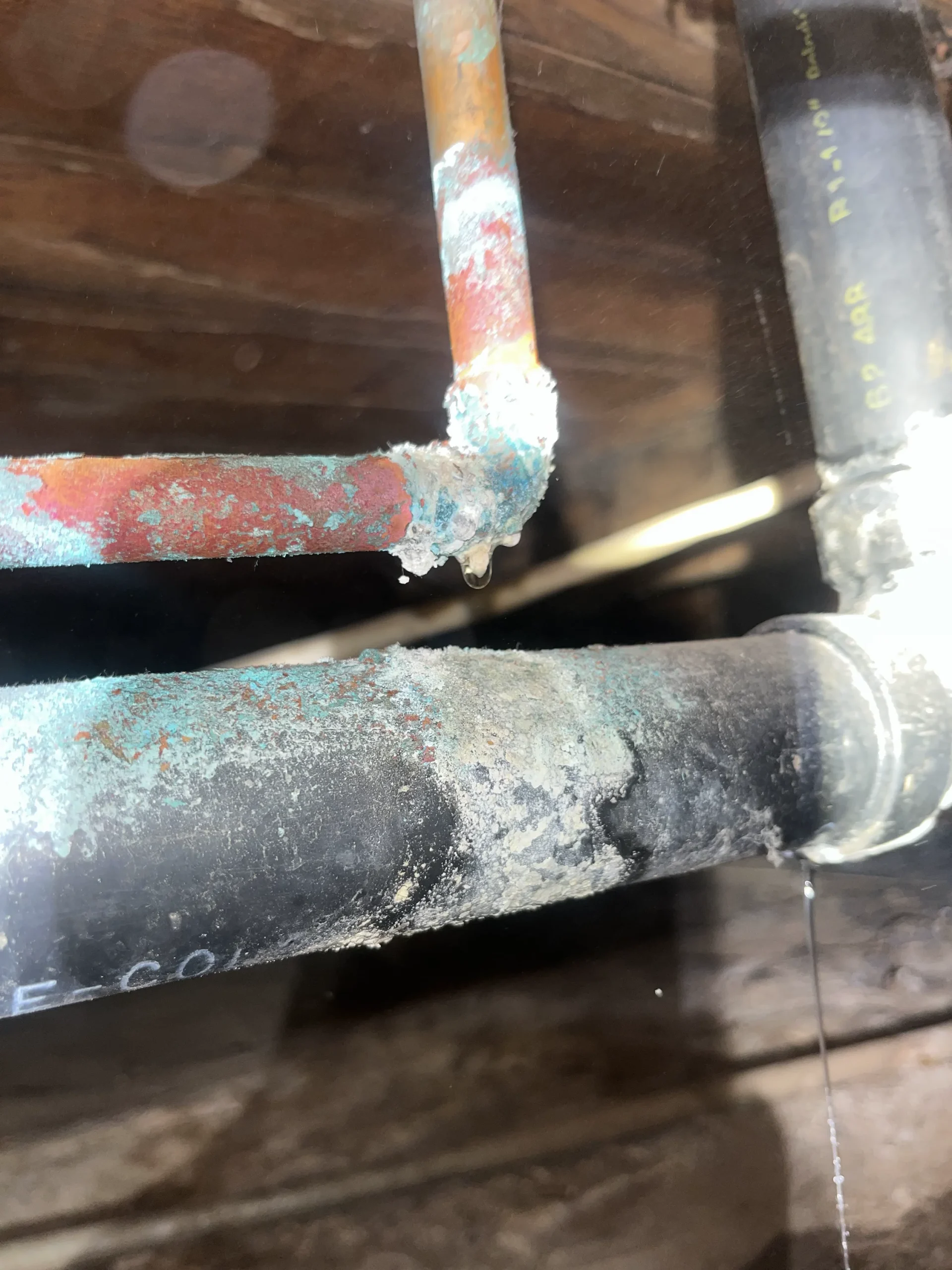 Mineral scale and corrosion on water pipes in a hard water South Bay home