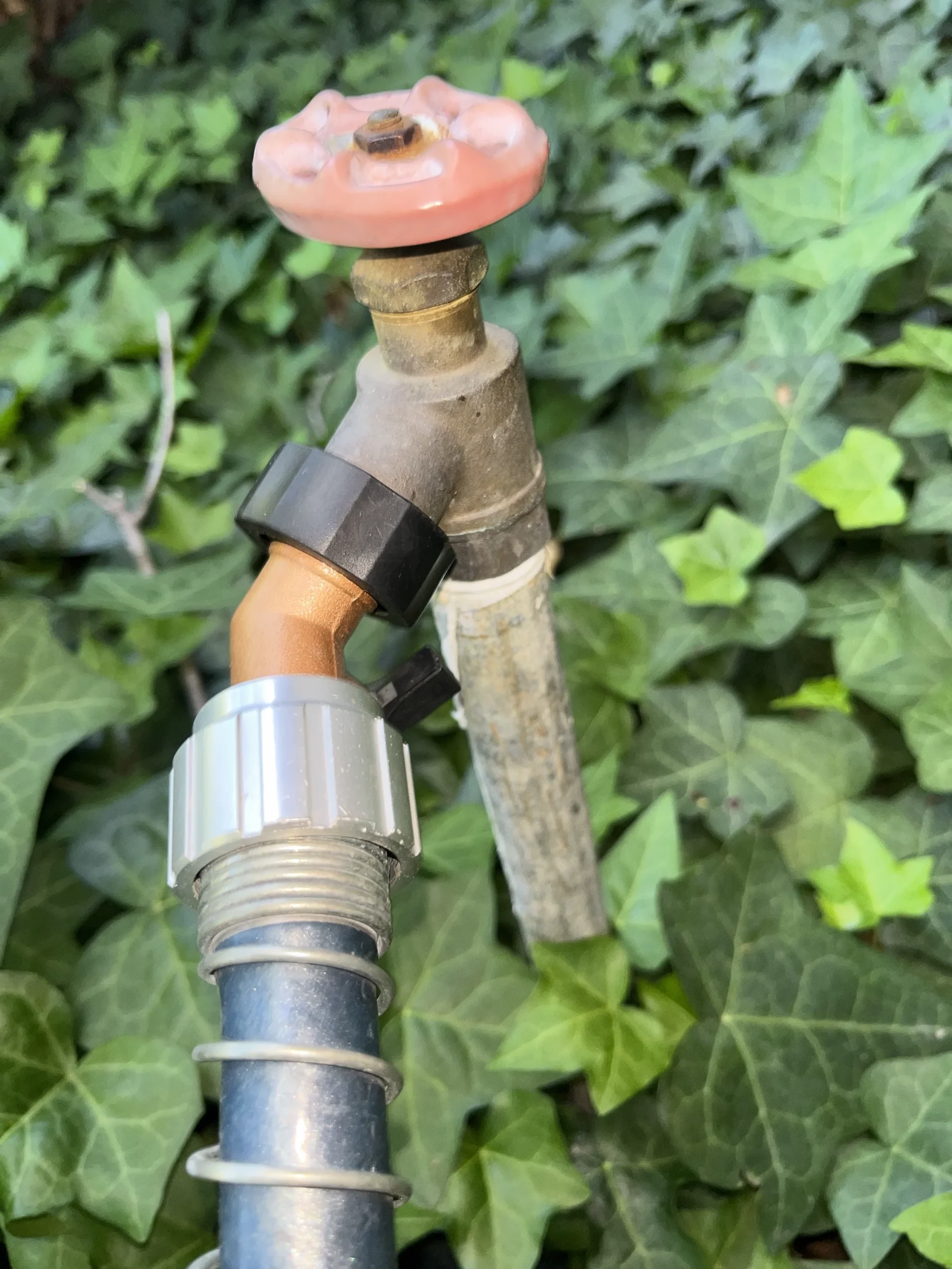 An older outdoor faucet before replacement by Simply Green Plumbing