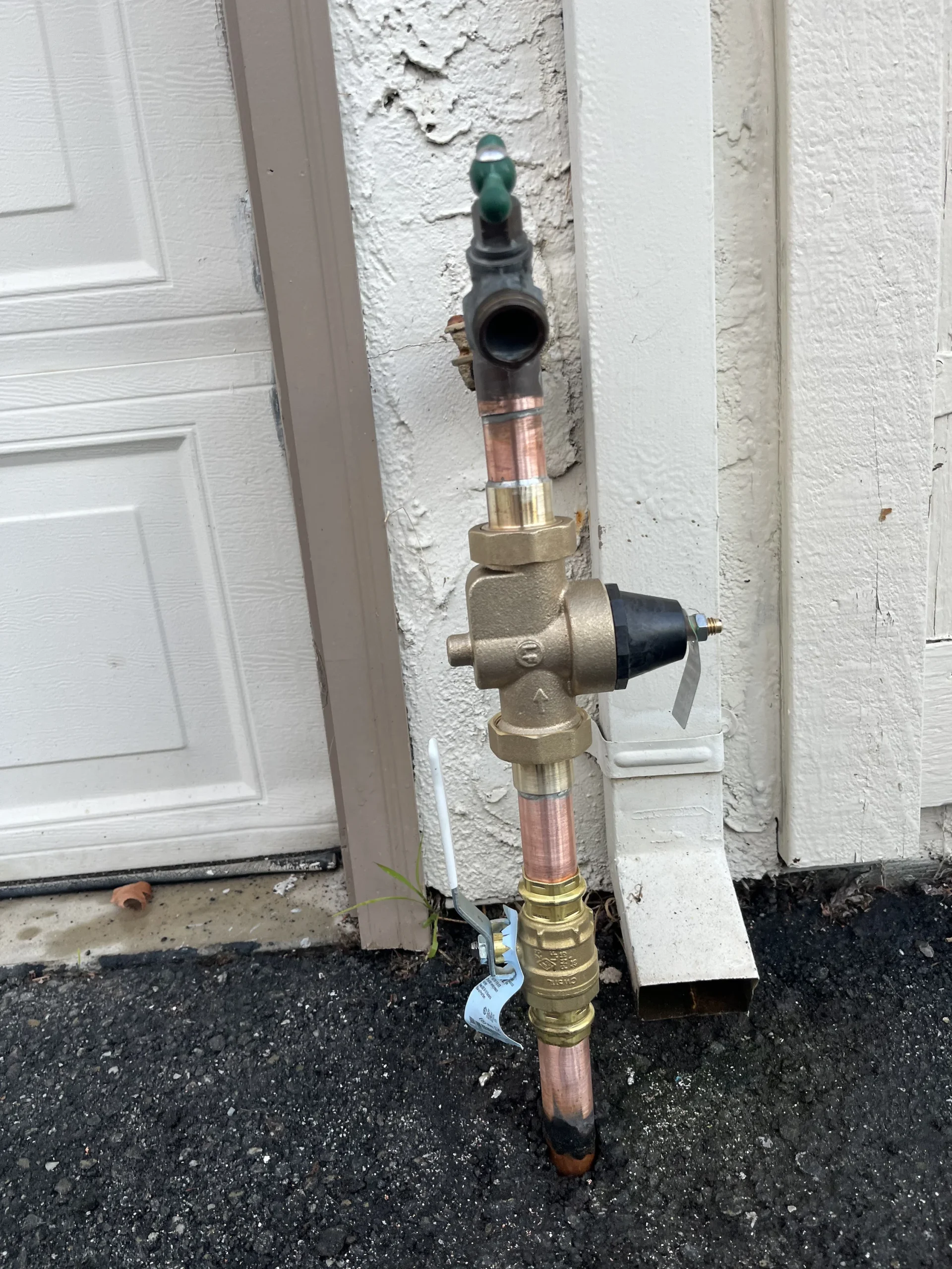 A new water pressure regulator on the water line at a Campbell, California property