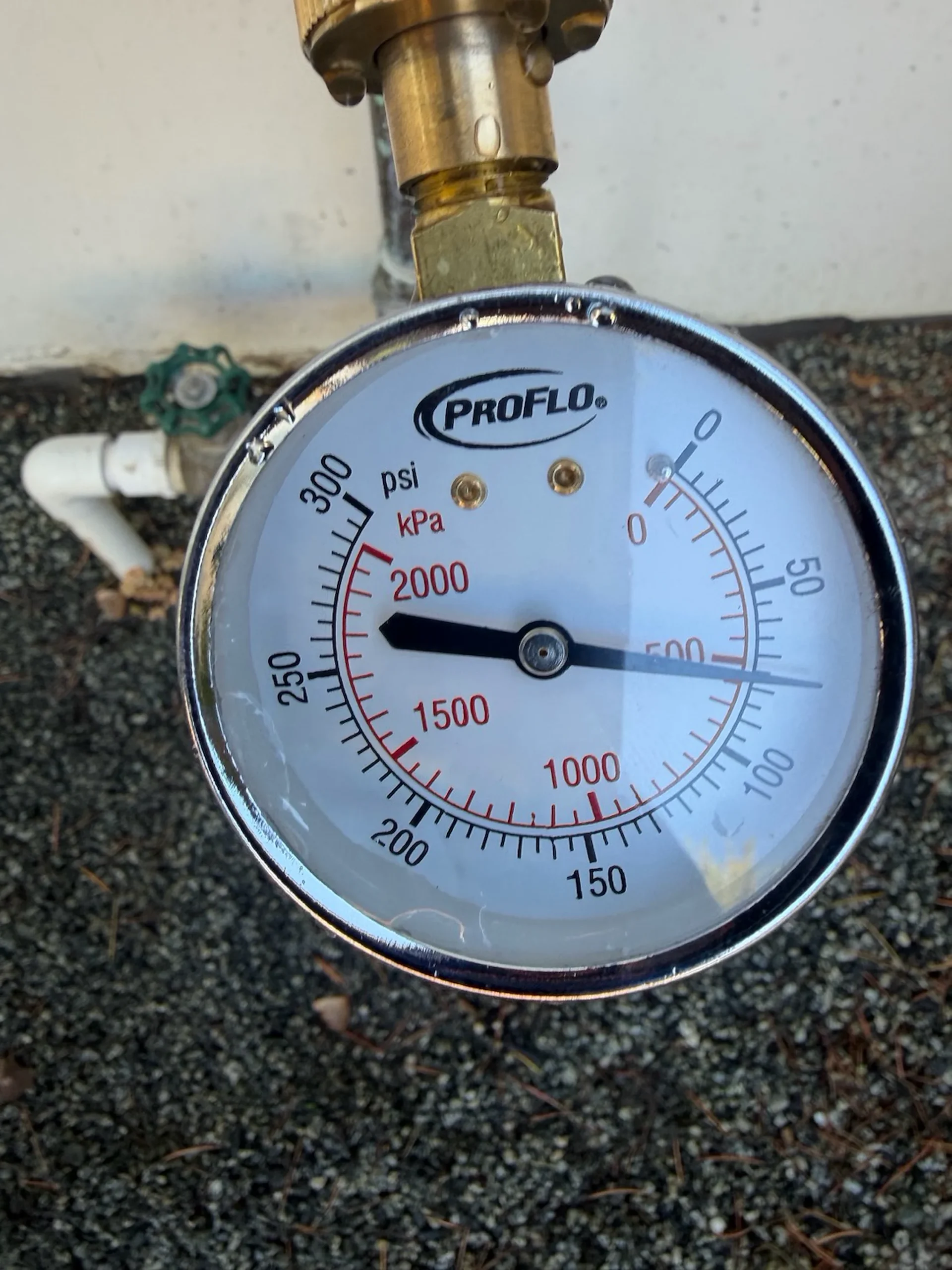 Pressure gauge on a hose bib checking water pressure at a Los Gatos home